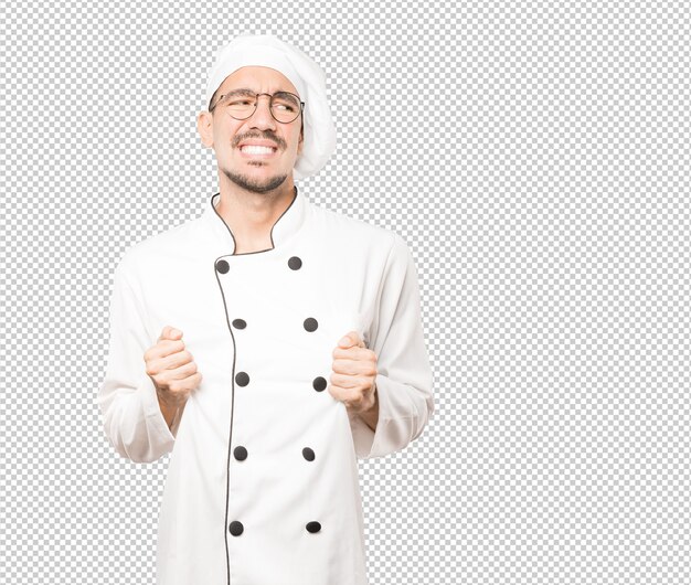 Joven chef preocupado con un gesto de estrés