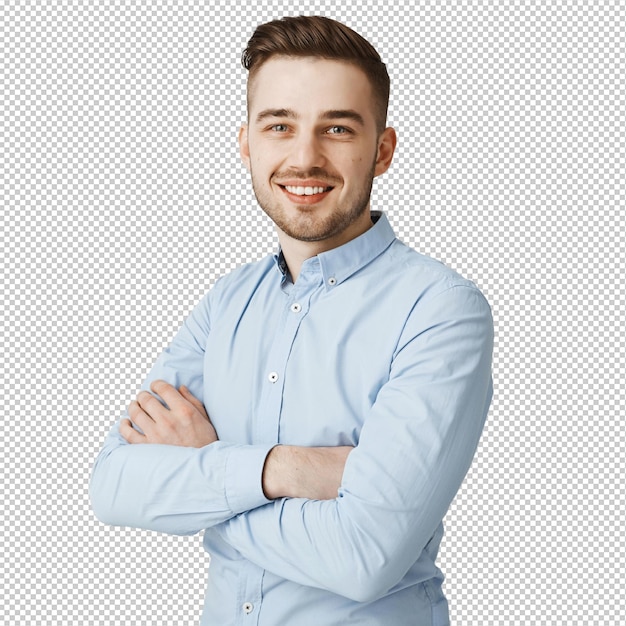 Joven y guapo hombre de negocios con los brazos cruzados sonriendo confiado
