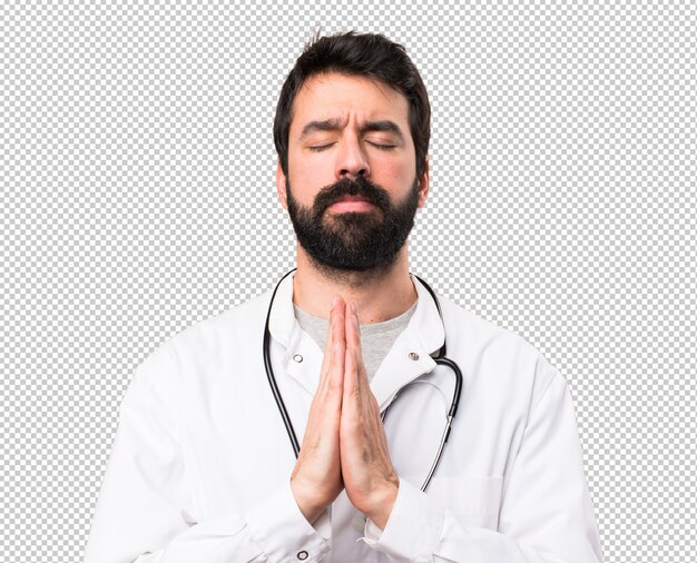 Joven médico en posición zen.