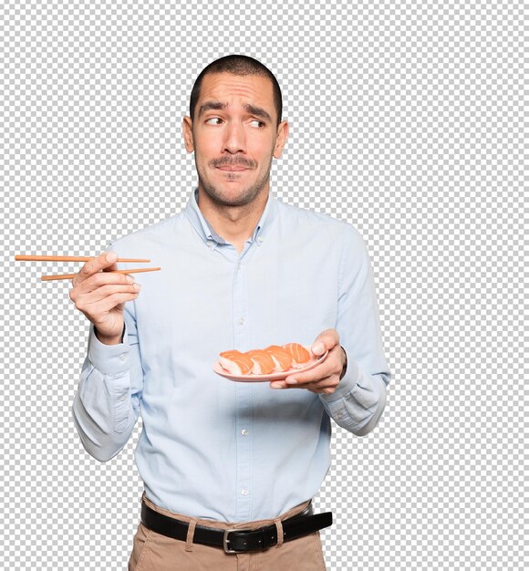 PSD joven con palillos para comer sushi