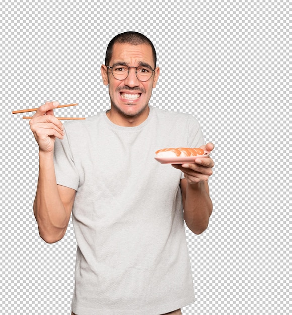 PSD joven con palillos para comer sushi