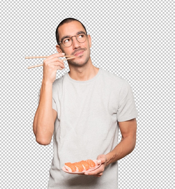 PSD joven con palillos para comer sushi