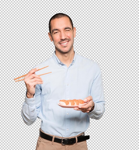 PSD joven con palillos para comer sushi