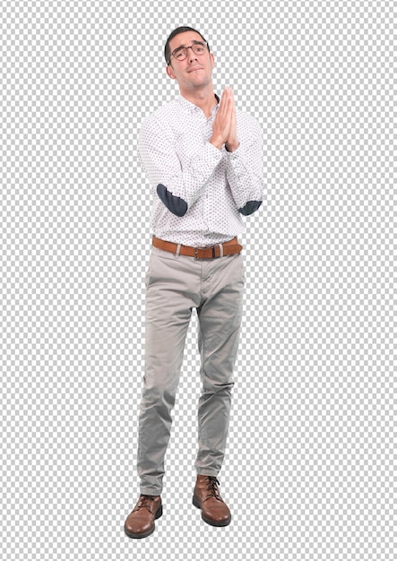 Joven preocupado con un gesto de oración - Full body shot