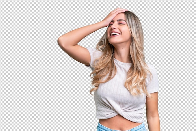 Junge uruguayische Frau über isolierten Hintergrund viel lächelnd