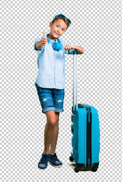 Kid Avec Des Lunettes De Soleil Et Un Casque Voyageant Avec Sa Valise Donnant Un Geste Du Pouce Levé