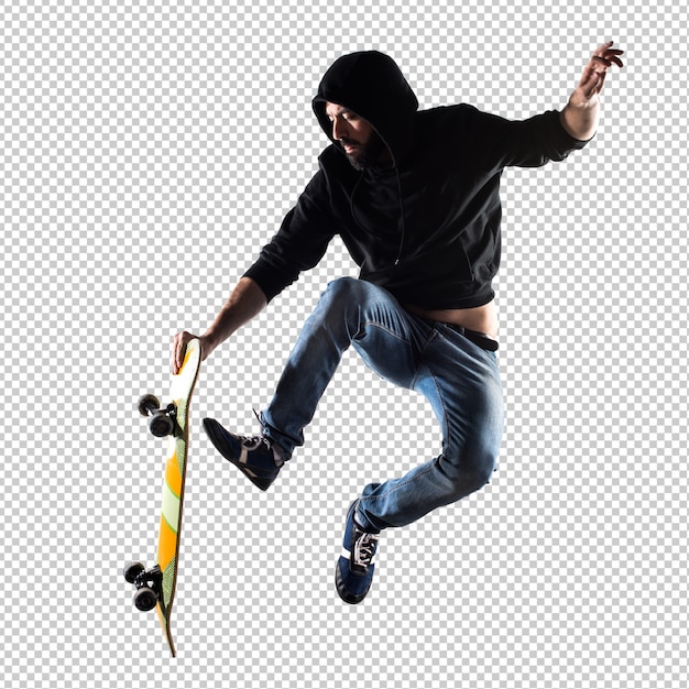 L&#39;uomo con il salto con lo skateboard