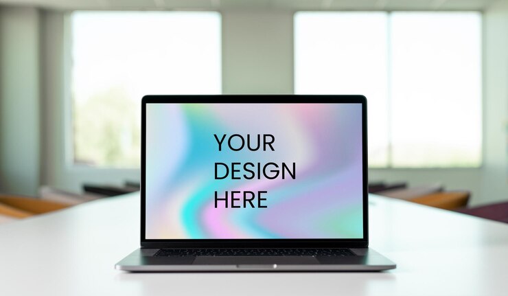 Laptop en la mesa con un fondo vibrante