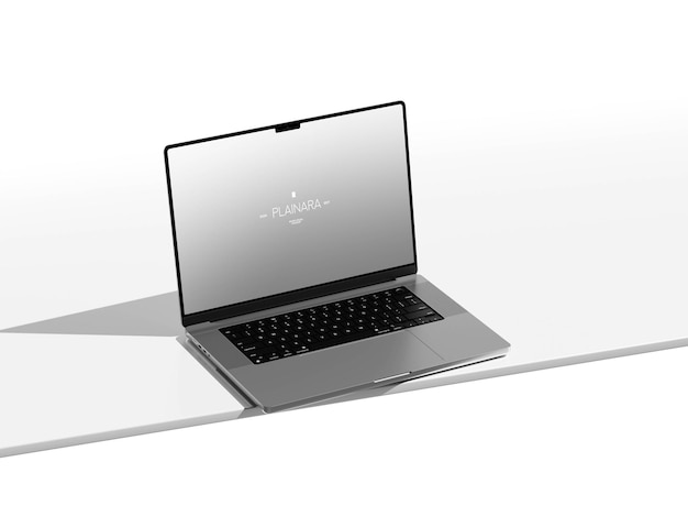 Laptop moderno plateado en una superficie blanca