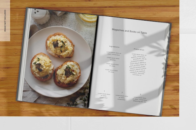 Libro a copertina rigida A4 su tavolo Mockup Top View