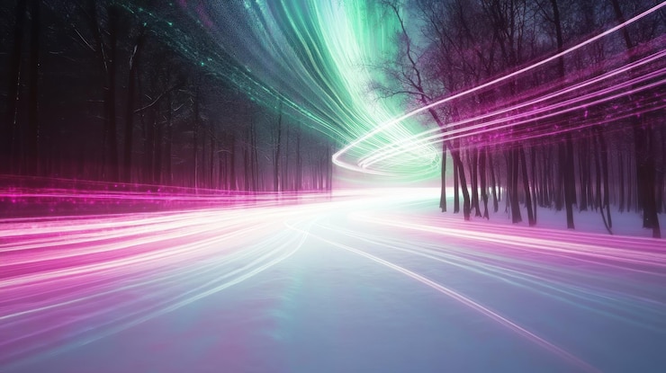 PSD light trails on snowy road through winter forest at night