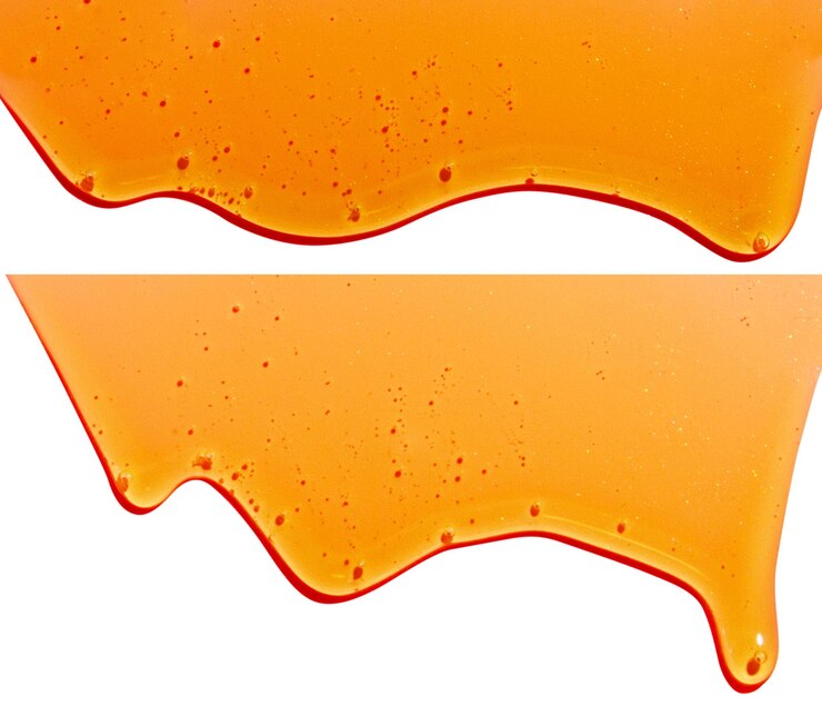 PSD liquido giallo che scorre su uno sfondo vuoto cosmetici al caramello di miele