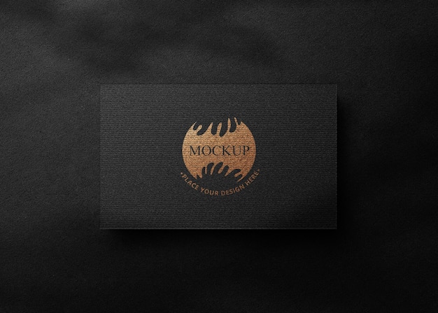 Logo Mockup su lamina d'oro e d'argento con carta di carta nera