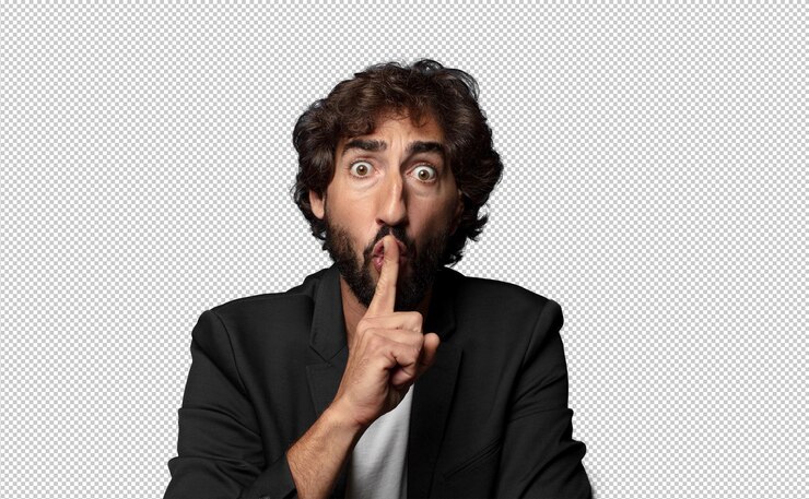 PSD looking serious and cross with finger pressed to lips demanding silence or quiet keeping a secret