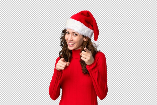 Mädchen mit Weihnachtshut zeigt Finger auf Sie