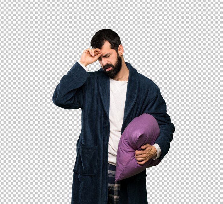 PSD man with beard in pajamas with tired and sick expression
