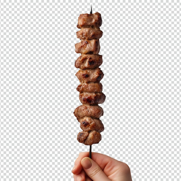 Manos sosteniendo shish kebab con pimientos de color