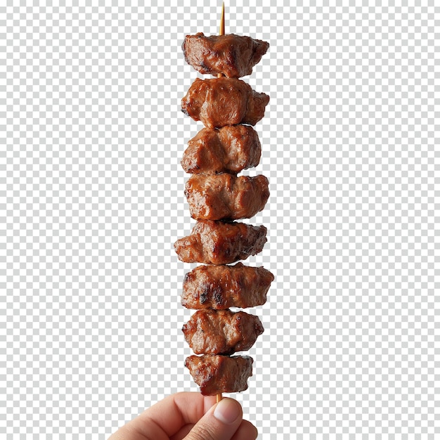 Manos sosteniendo shish kebab con pimientos de color