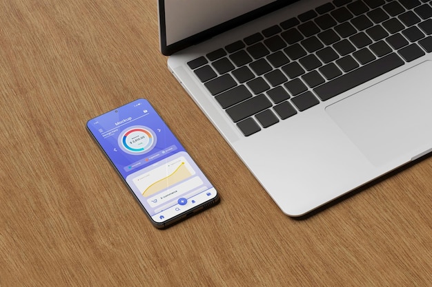 Maqueta de aplicación de teléfono inteligente con computadora portátil al costado