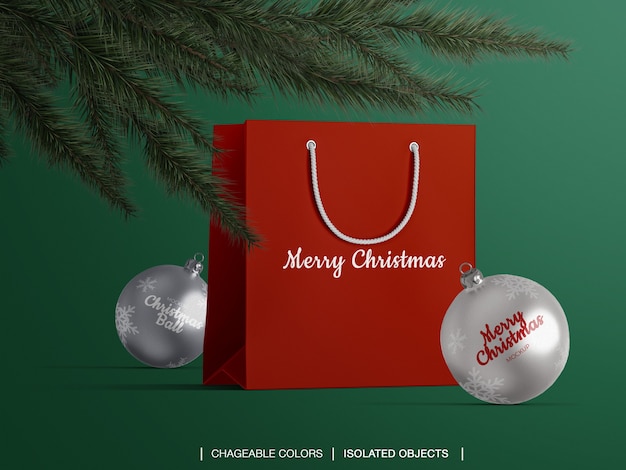 Maqueta de bolsa de papel y bolas de Navidad debajo del árbol de Navidad
