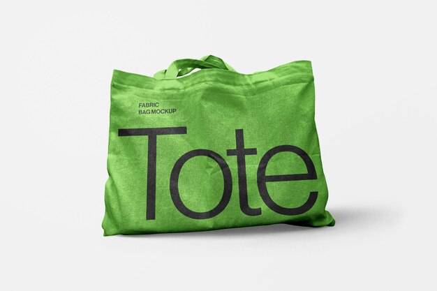 Maqueta de bolsa de tote de tela PSD en superficie blanca