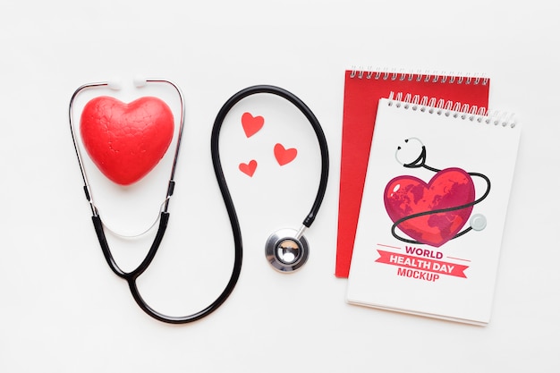 Maqueta y corazones planos del día de la salud