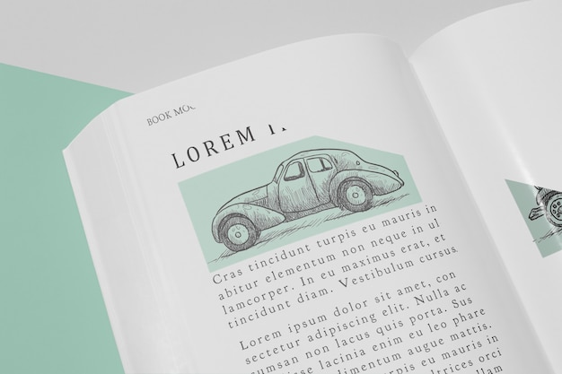 Maqueta de libro abierto de alto ángulo con ilustración de coche