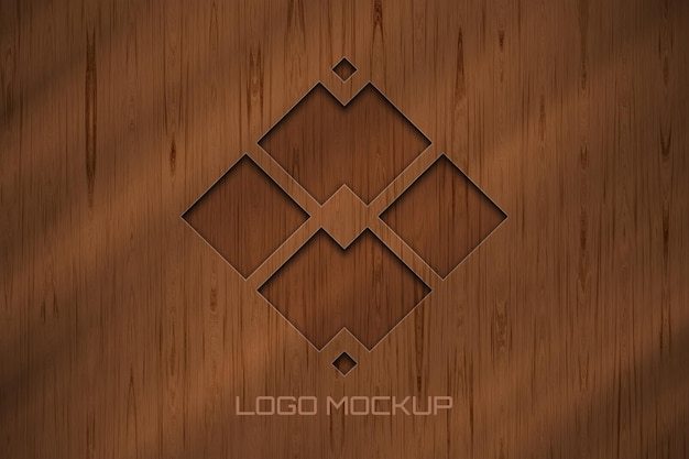 Maqueta de logo elegante en pared de madera