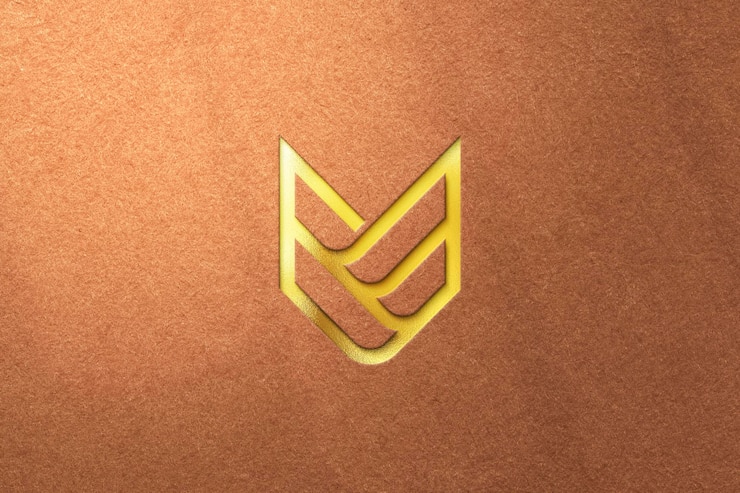 PSD maqueta de logotipo dorado sobre fondo texturizado
