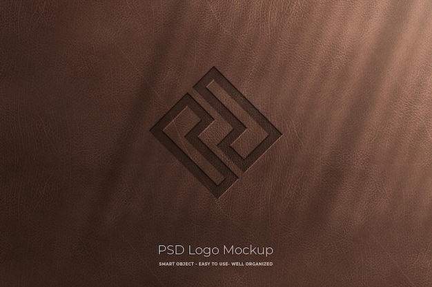 PSD maqueta de logotipo grabado en textura de cuero para presentación de logotipo