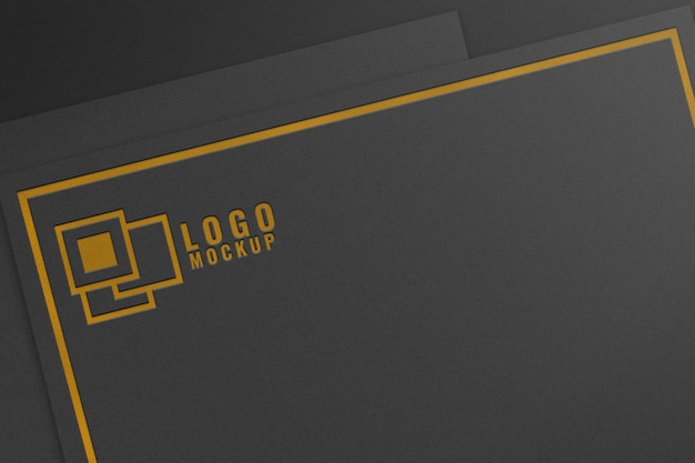 maqueta de logotipo de lámina de oro sobre papel negro