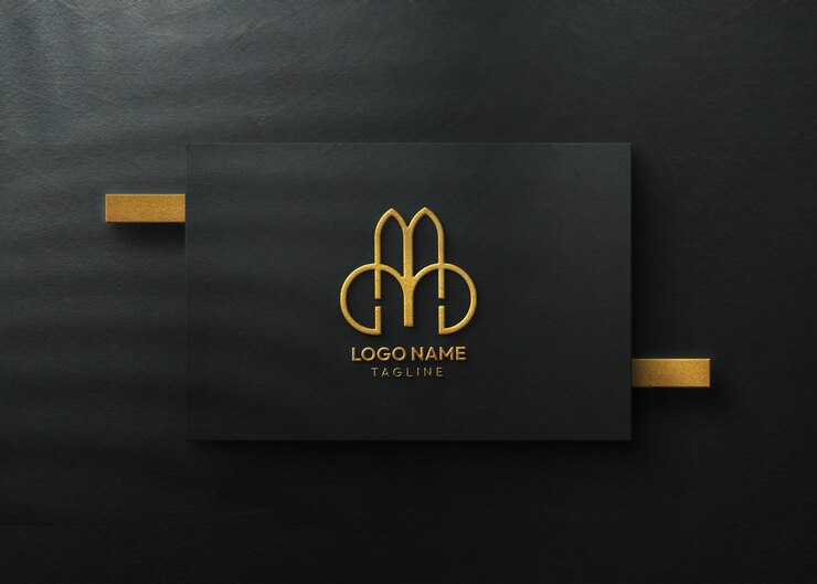 Maqueta de logotipo de lujo con efecto en relieve dorado en superficie negra