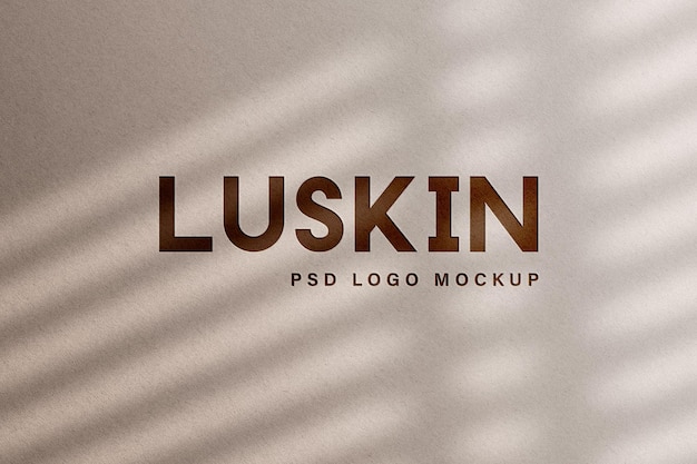 maqueta de logotipo marrón grabado