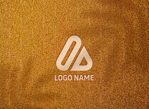 PSD maqueta de logotipo premium en textura de pared dorada