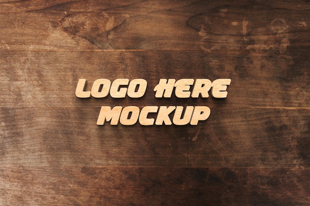 Maqueta del logotipo con superficie de madera