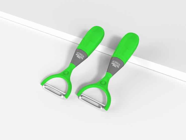 PSD maqueta de pelador de verduras de cocina de plástico brillante