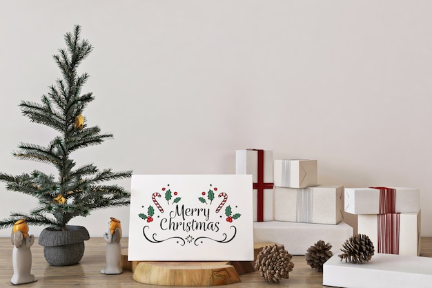 Maqueta de tarjeta de felicitación de feliz navidad con árbol de navidad, decoración y regalos