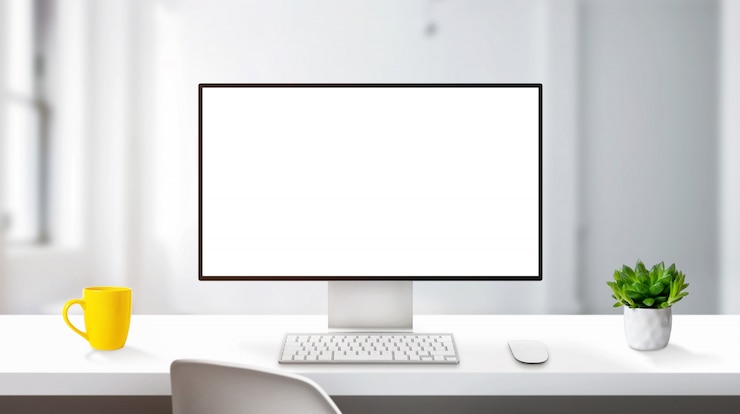 PSD maquete de exibição de computador moderno na mesa de trabalho com bordas finas. conceito de estúdio de design profissional