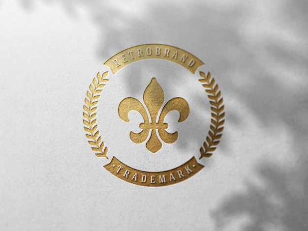 PSD maquete de logotipo de estampagem de folha de ouro de luxo em papel branco texturizado