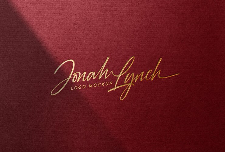 Maquete de logotipo de folha de ouro de luxo em papel vermelho com sombra de sobreposição