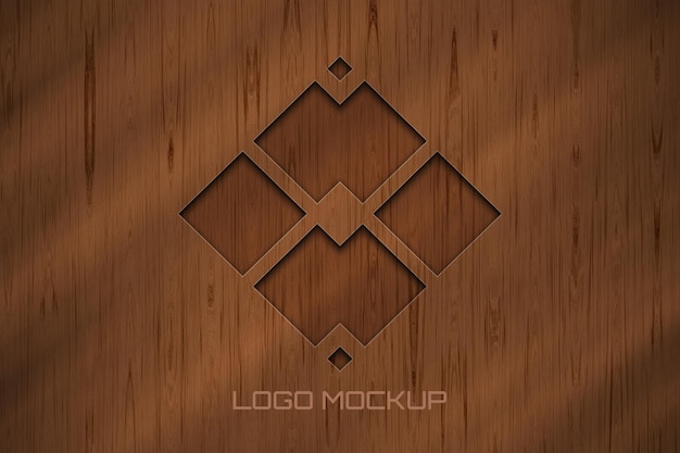 Maquete de logotipo elegante na parede de madeira