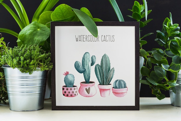 Maquete de quadro ao lado de plantas