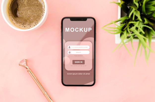 Maquete de smartphone plana com café e planta
