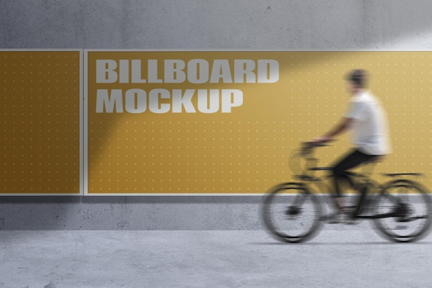 Maquette de bannière de feuille de toile de conception de médias de panneau d'affichage publicitaire sur le mur avec l'équitation de cycliste