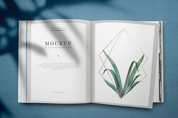 Maquette magazine avec feuilles et cadre doré