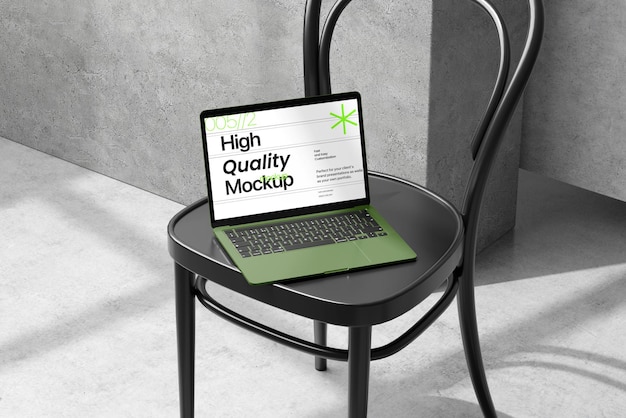 Une maquette d'ordinateur portable avec une chaise réaliste.
