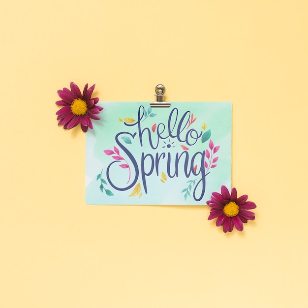 Maquette de printemps plat laïcs avec carte de voeux