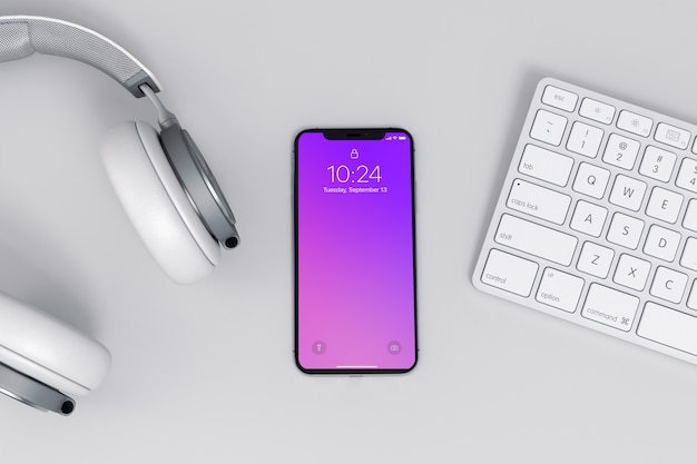 Maquette de smartphone avec clavier et casque