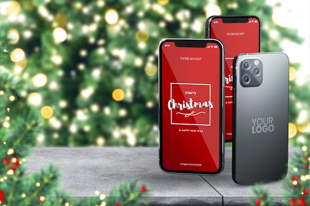 PSD maquette de smartphone de trois iphone 13 sur fond de noël avec sapin de noël