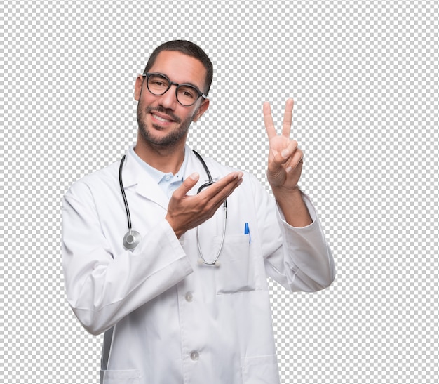 Médico jovem confiante com um gesto de número dois